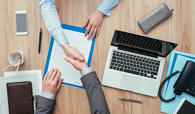 A Client and a Manager of a Firm Shaking Hands