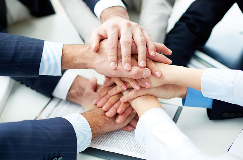 A Group Handshake of a Project Team