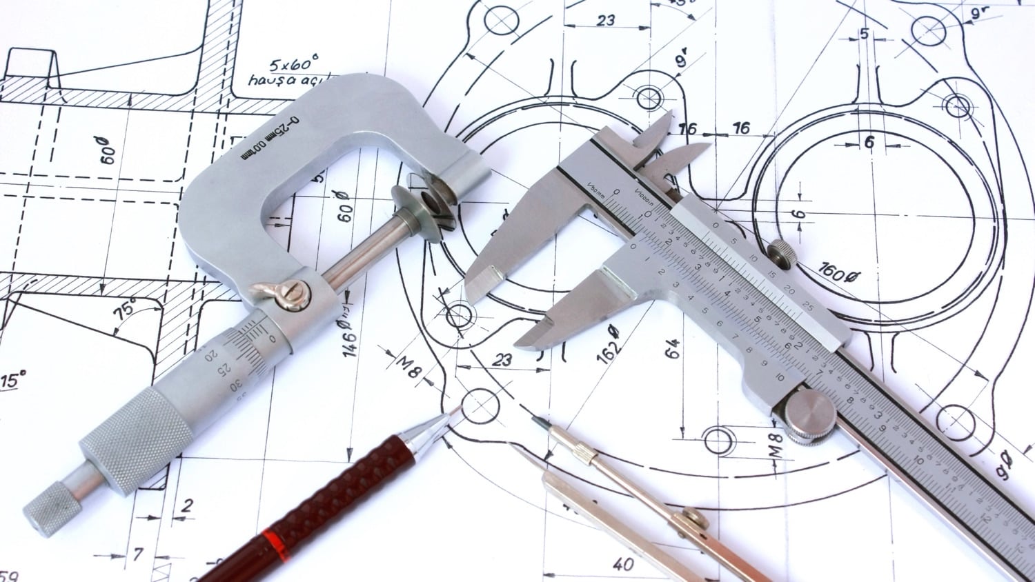 AutoCAD scale factor chart and calculator AutoCAD scale factor chart: micrometer, caliper and compass on a technical drawing